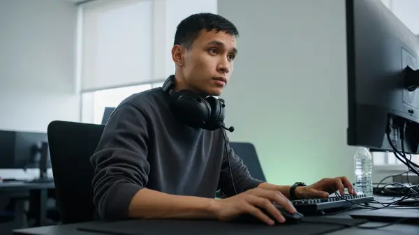 Focused player portrait during practice with headset on