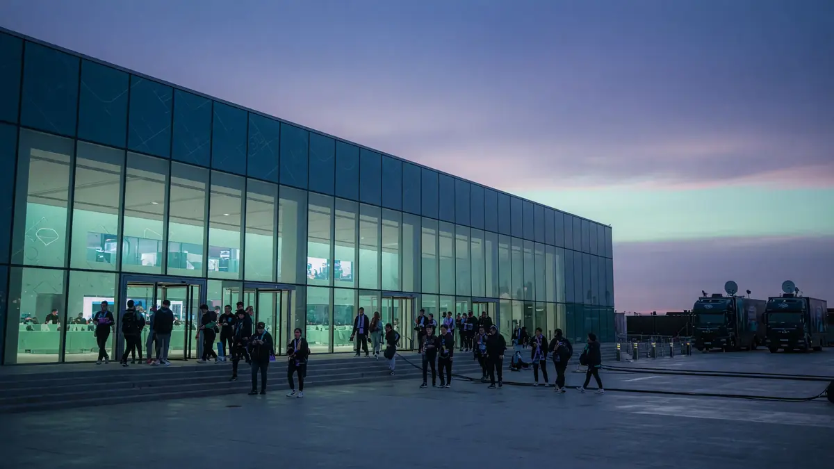 International esports tournament venue exterior at blue hour